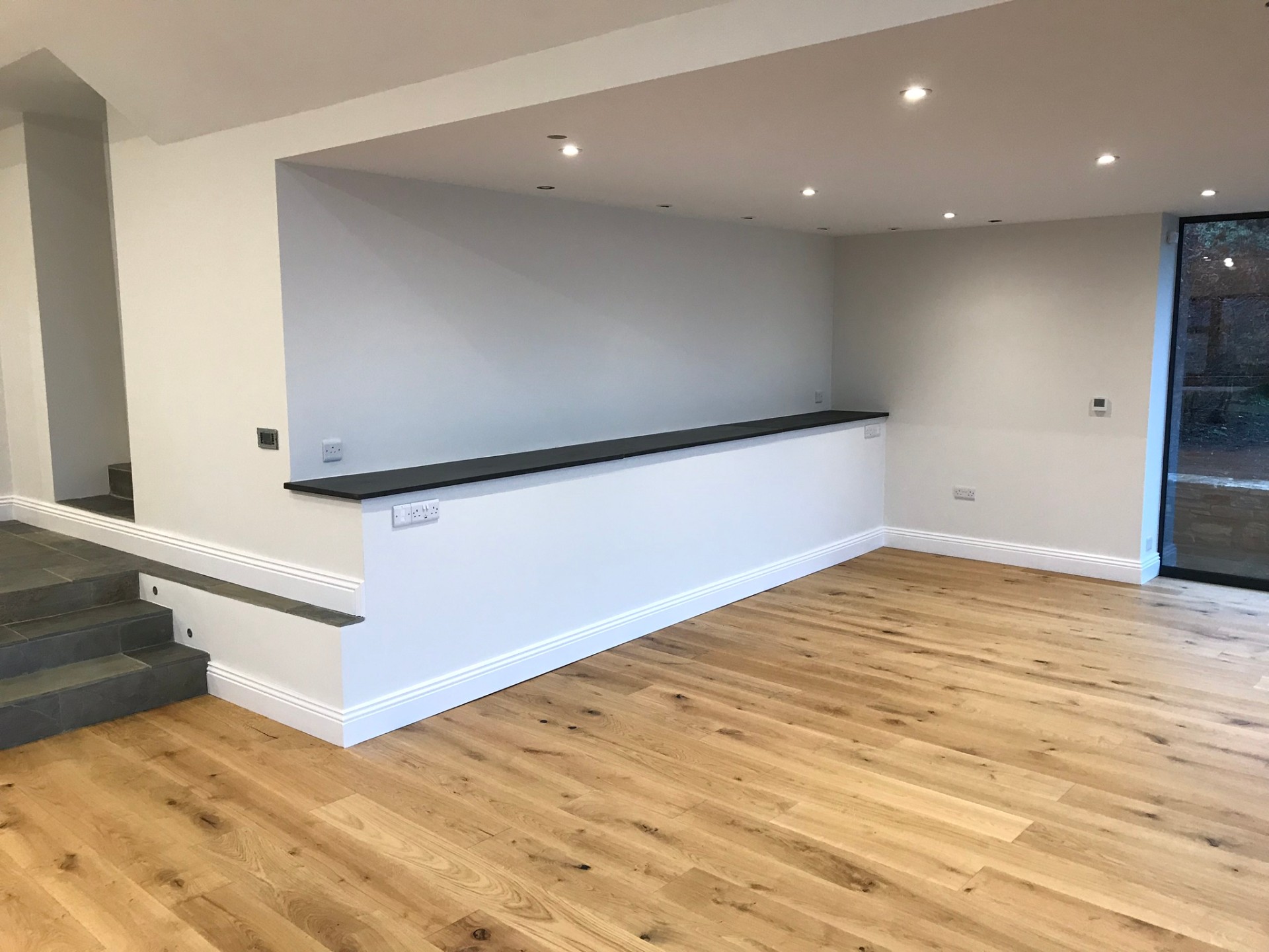 Split-level interior with slate flooring and oak boards
