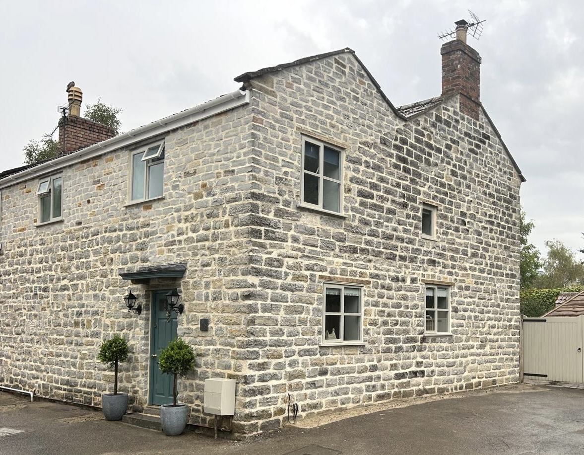 Renovated stone cottage with new door and windows