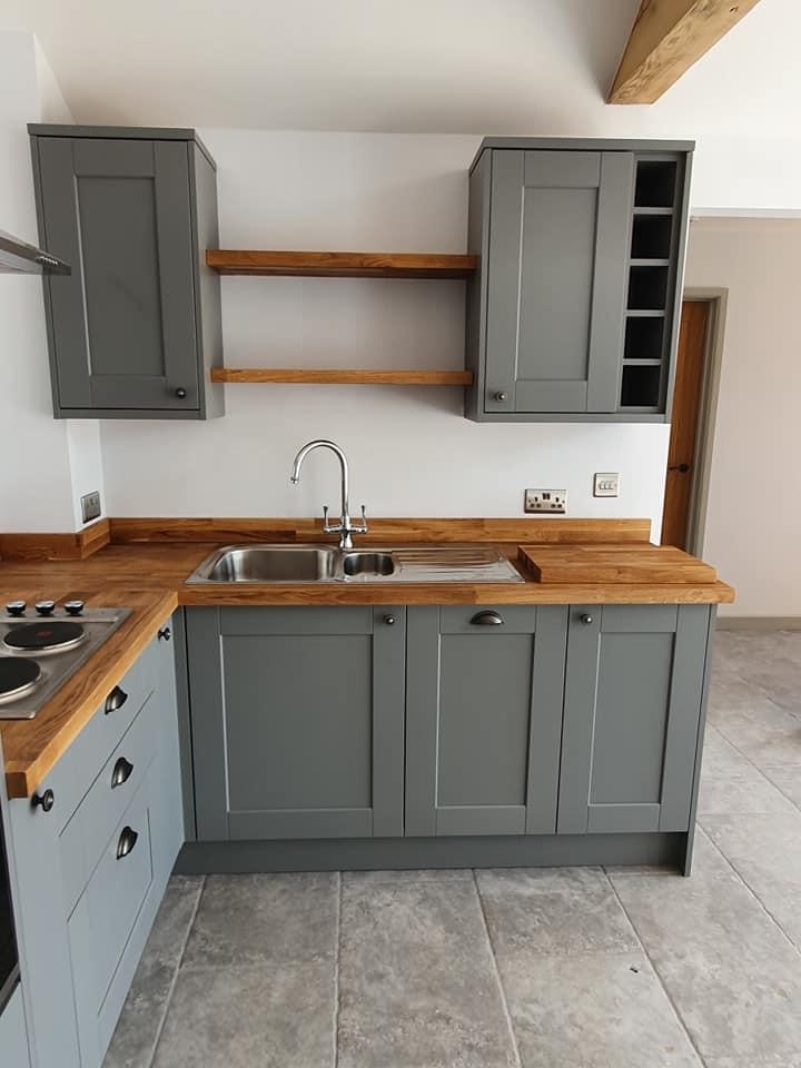 Shaker kitchen detail with solid oak worktops and open shelving
