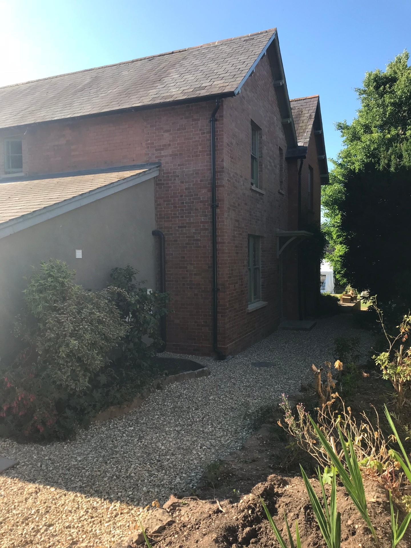 Rebuilt gable end with reclaimed brick, seamlessly matched to the original Victorian house